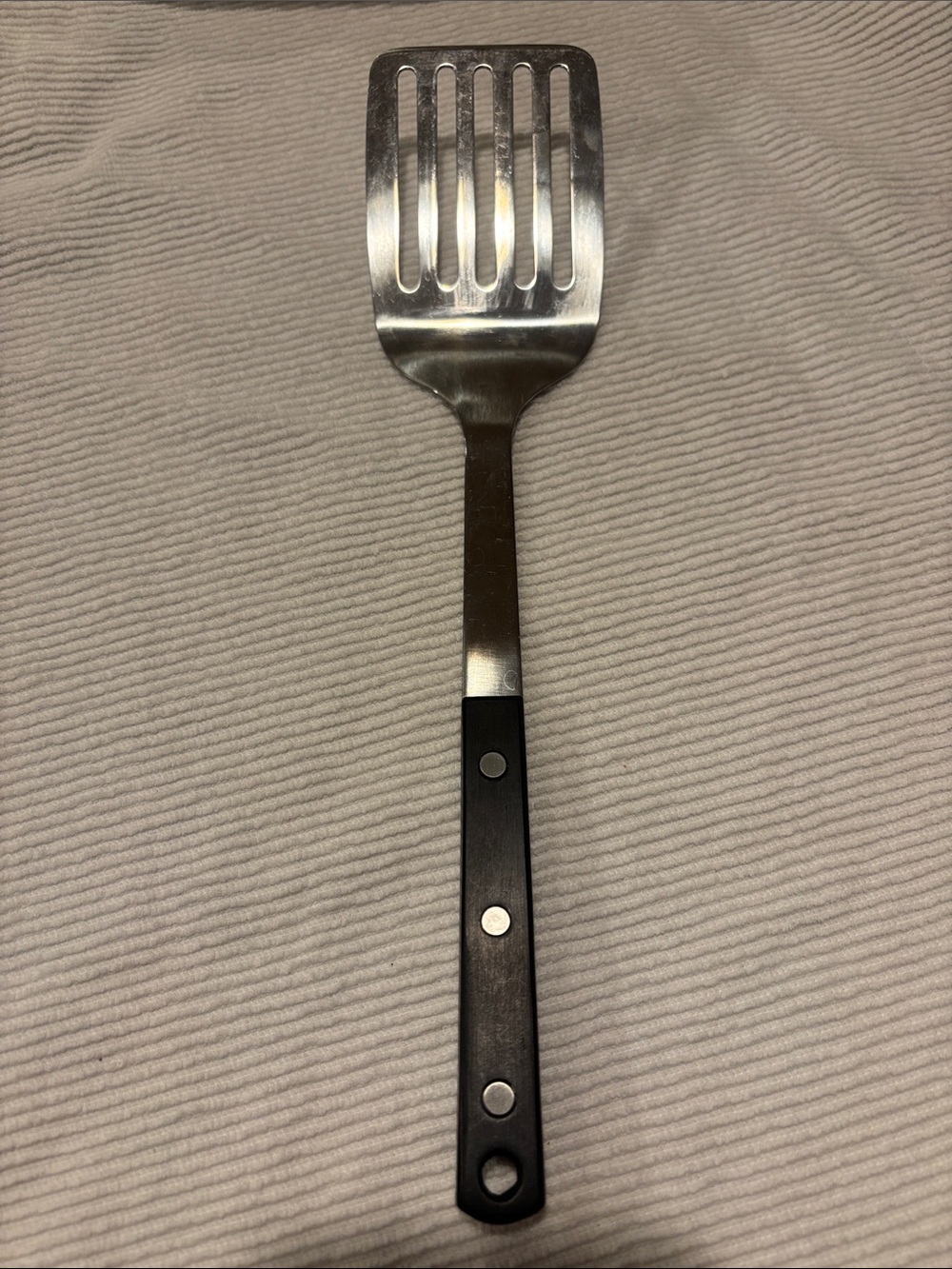 Martha Stewart Stainless Steel Slotted Spatula with Black Handle